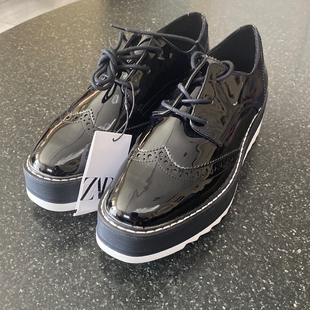Platform Zara loafers with shoelaces. It is size 7 1/2.